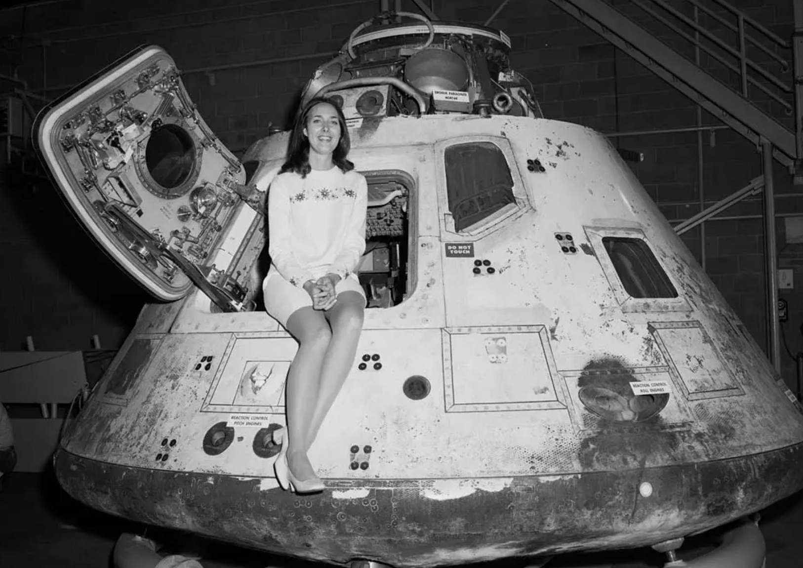 Patricia Coles, Miss NASA, poses with the Apollo 8 capsule 
